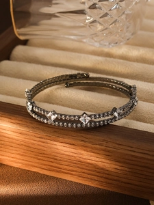 Close-up of double-layer tennis bracelet with square zircons on velvet jewelry tray