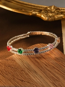 Close-up of double-layered luxury bracelet with colorful gemstones and zircon accents