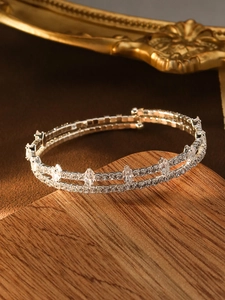 Detail of silver double-row bracelet with marquise and round cubic zirconia in luxury style
