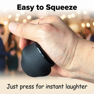 Detail showing the easy-to-squeeze black rubber prank toy being pressed by a hand