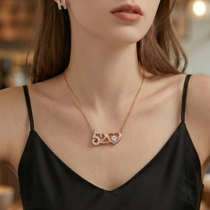 Rose gold heart pendant necklace with 520 design and moving zircon on a model