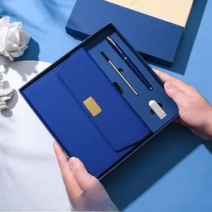 Navy blue premium business gift set featuring a leather notebook, pen, and USB drive in a box