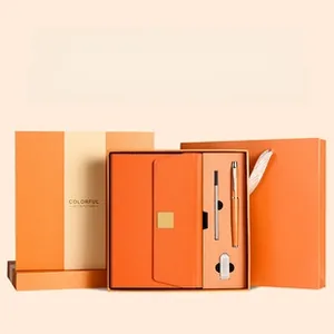 Premium orange faux leather A5 notebook gift set with matching pen and carry bag