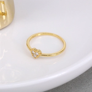Macro shot of S925 sterling silver heart ring with zircons and fine gold plating