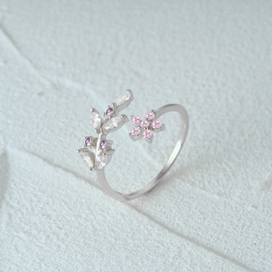Close-up of vintage S925 silver flower ring with pink and purple zircon gemstones