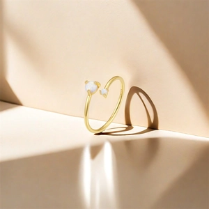 Macro view of S925 hallmark on gold plated sterling silver ring with opal stones