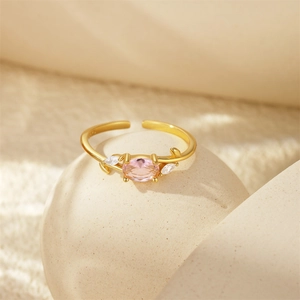 Macro shot of S925 hallmark on gold plated ring with pink gemstone and white zircon