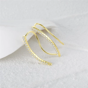 Detail view of J-curve S925 sterling silver earrings with inlaid white zircons