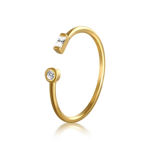 Close-up of gold adjustable open ring with baguette and round cut zircon stones