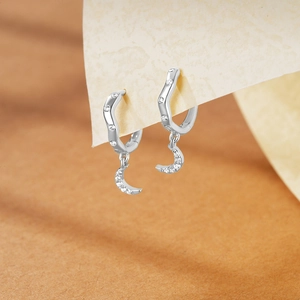 Close-up of S925 sterling silver moon drop earrings with zircon stones and wavy hoops