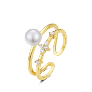 Close-up of vintage S925 silver ring with double-layer gold band, pearl and zircon