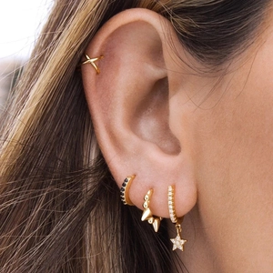 Detail of 4-piece S925 silver gold-plated earring set featuring star charms and zircons