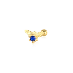 Detail of a gold bee earring with a blue zircon stone and screw back closure