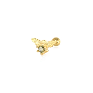 Macro view of gold bee stud earring with green zircon and screw ball back fastener