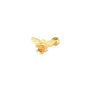 Macro shot of gold bee cartilage stud earring with orange zircon and ball screw back