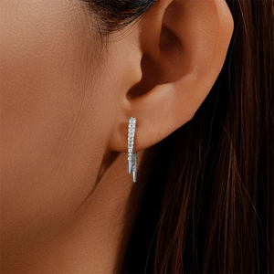 Detailed close-up of S925 sterling silver hoop earring with pavé set white cubic zirconia
