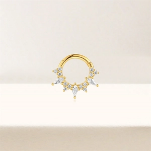 Close-up of golden s925 silver hoop ring with crown-shaped marquise stones and clear gems