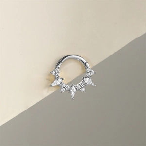 Detail of s925 silver piercing ring with marquise cut diamonds and opal stone inlay