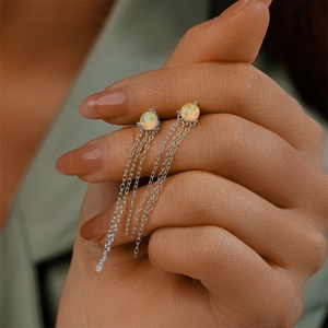 Detailed view of S925 silver fringe earrings featuring opal stones and long tassels