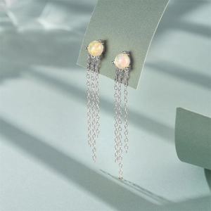 S925 silver fringe chain earrings with opal and diamonds on a minimalist display
