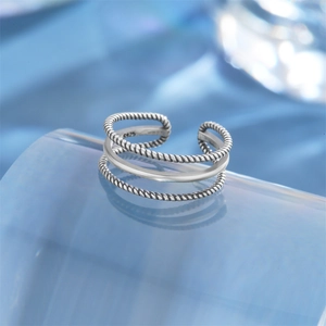 Macro shot of S925 sterling silver lotus toe ring featuring vintage twisted rope textures