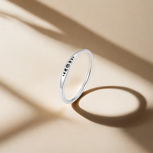Macro detail of s925 silver ring band showcasing etched moon phase cycle pattern