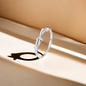 Macro shot of S925 sterling silver lotus ring featuring delicate vine patterns and hallmark