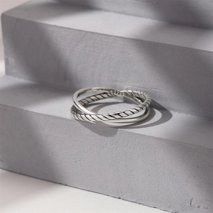 Close-up of S925 sterling silver ring showing double-band twist and smooth textures