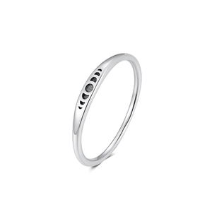 Macro detail of S925 sterling silver ring showing engraved moon phases with black oxidation