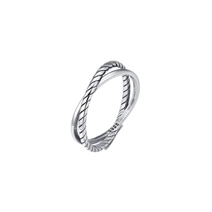 Close-up of S925 sterling silver ring showing twisted rope texture and dual-band design
