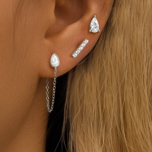 Macro shot of S925 sterling silver four-petal flower earring set with sparkling zircons