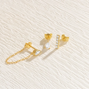 Close-up of gold S925 silver earring set featuring flower chain and zircon accents