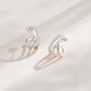 Detailed view of S925 sterling silver geometric stud earrings with sparkling cubic zirconia