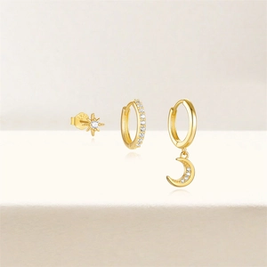 Detail of S925 sterling silver stamp on gold flower and star earring set with zircon