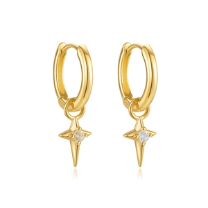 Detailed view of gold hoop earrings featuring polished star pendants with clear zircon