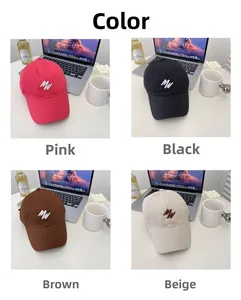 Detail view of cotton baseball caps in pink, black, brown and beige with MW embroidery