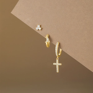 Detail of s925 gold silver earring set with flower moon and cross zircon pendants