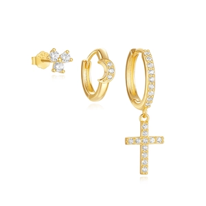 Detail of 925 silver gold-plated earring set with zircon star moon and cross charms