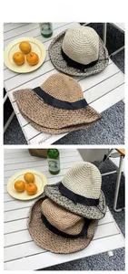 Detail of hand-woven straw hats with black polka dot mesh and silk bow tie accents