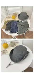 Close-up of washed cotton fabric texture and metal eyelets on vintage outdoor sun hats