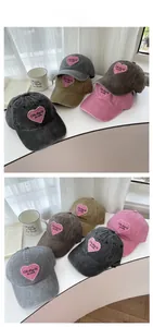 Detail of multi-color washed cotton baseball caps with pink heart embroidery Ofr.Paris