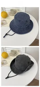 Detail view of washed cotton bucket hats with metal side vents and adjustable chin straps