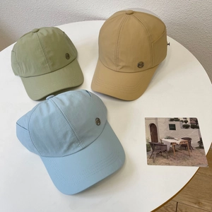 Three waterproof ponytail baseball caps in light green, khaki, and sky blue colors