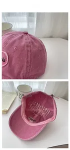 Detail view of pink vintage washed cotton baseball cap with Paris embroidery and inner lining