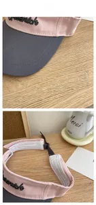 Detail of adjustable strap and sweatband inside pink and grey sun visor hat