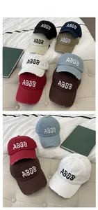 Detailed view of ABDB embroidery and distressed edges on vintage cotton baseball cap