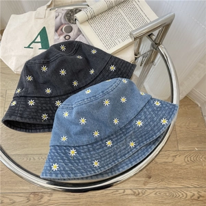 Denim bucket hats with daisy embroidery in dark grey and classic blue colors