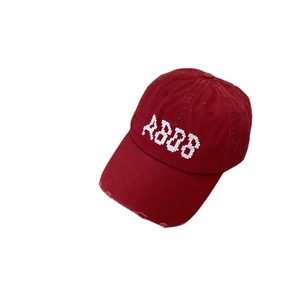 Deep red vintage baseball cap with AB88 embroidery and distressed ripped brim details