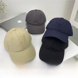 Quick-dry baseball caps in four colors on a desk with outdoor sun protection details