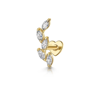 Macro detail of gold earring featuring marquise-cut stones and a heart-shaped flat back